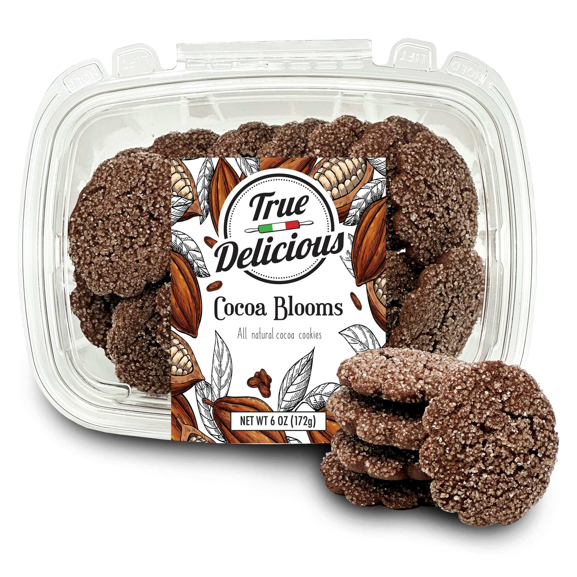 A clear plastic container labeled True Delicious Cocoa Blooms Cookies holds sugar-coated cocoa cookies, with several stacked beside it. The label displays cocoa beans and leaves. Net weight: 6 oz (172g).