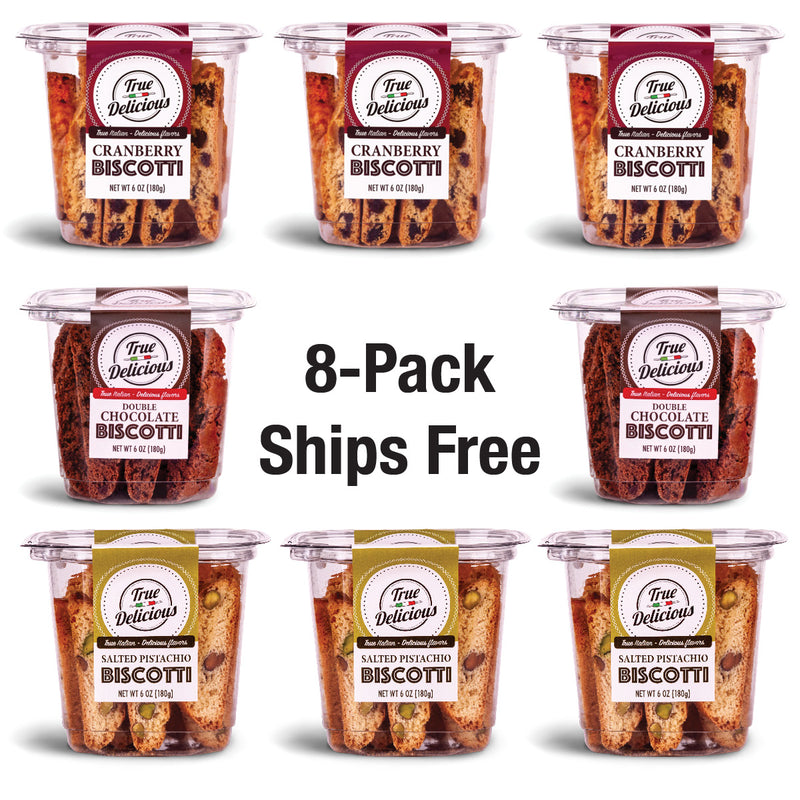 ["Eight tubs of True Delicious Bundle of the Month natural cookies in cranberry, double chocolate, and salted pistachio are arranged around “8-Pack Ships Free” text—your perfect biscotti bundle with free shipping."]