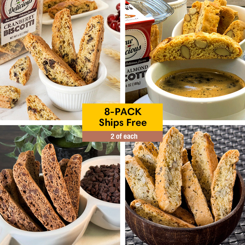 Four types of True Delicious Bundle of the Month non-GMO biscotti are displayed with coffee and ingredients. A yellow banner says “8-PACK Ships Free, 2 of each.” Enjoy this delicious assortment’s variety of flavors and textures.